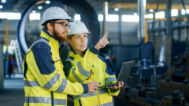 Employees wearing fluro PPE for protection and visibility