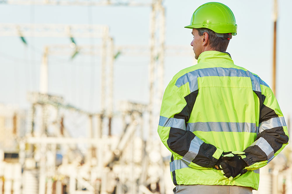 worker on contruction site with safety gear