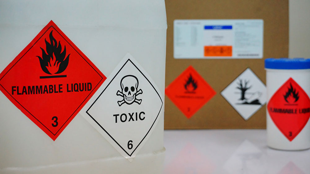 Containers and boxes labeled Toxic.