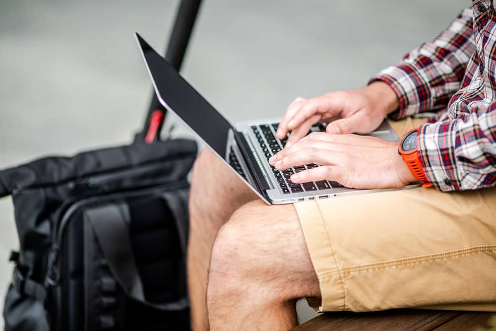 worker with backpack and laptop