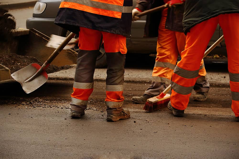 workers on road in uniform