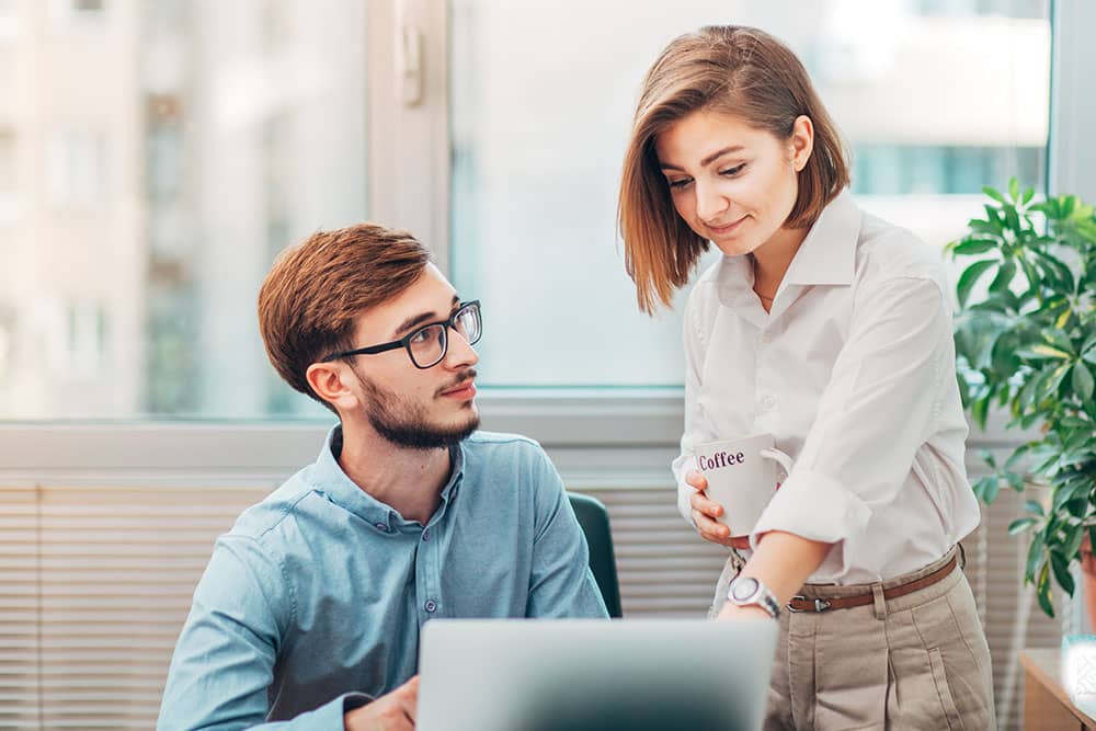 workers at office in corporate attire