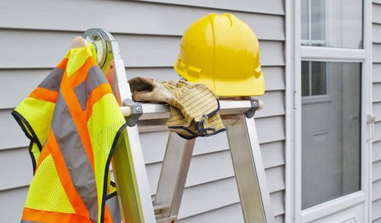 High visibility vest and hard hat.