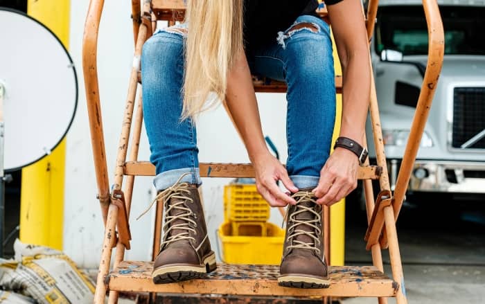 Woman wearing work boots.