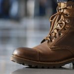 Close up of steel cap boots on an airplane